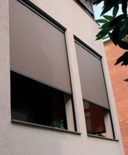 Zip system exterior roller shades on windows